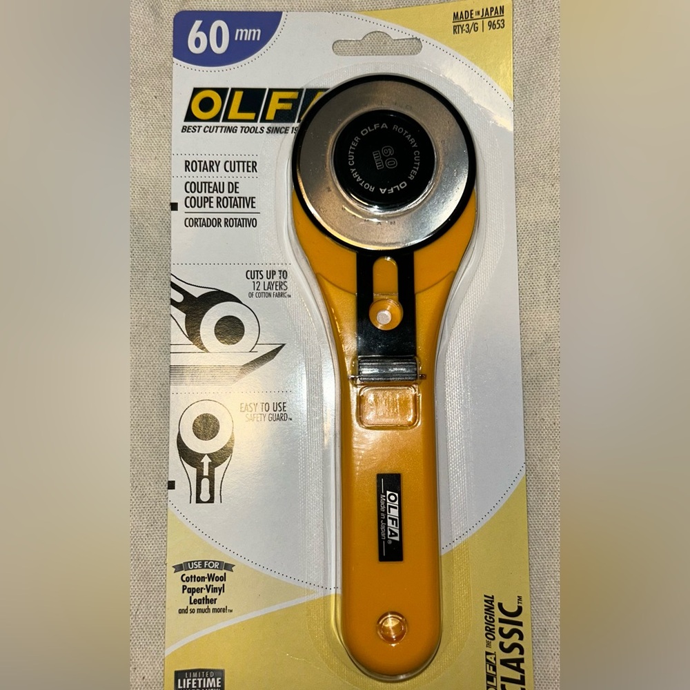 Olfa  60 mm rotary cutter New in box w 2 refill blades
